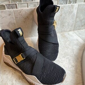 PUMA Black High-Top Sneakers with Gold Accents